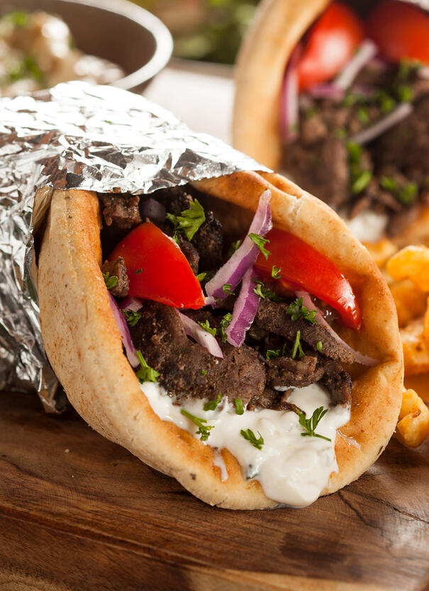 Gyro Pita with meat, tomato, onion, and tzatzik sauce